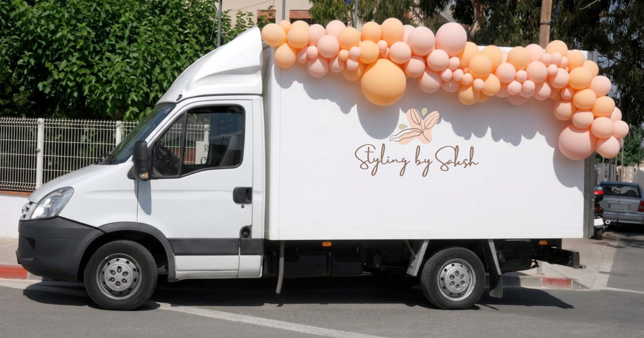 Styling by Saksh branded delivery van with a balloon garland